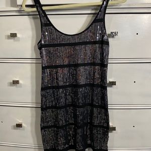 Black top with sequins. Very cute.
